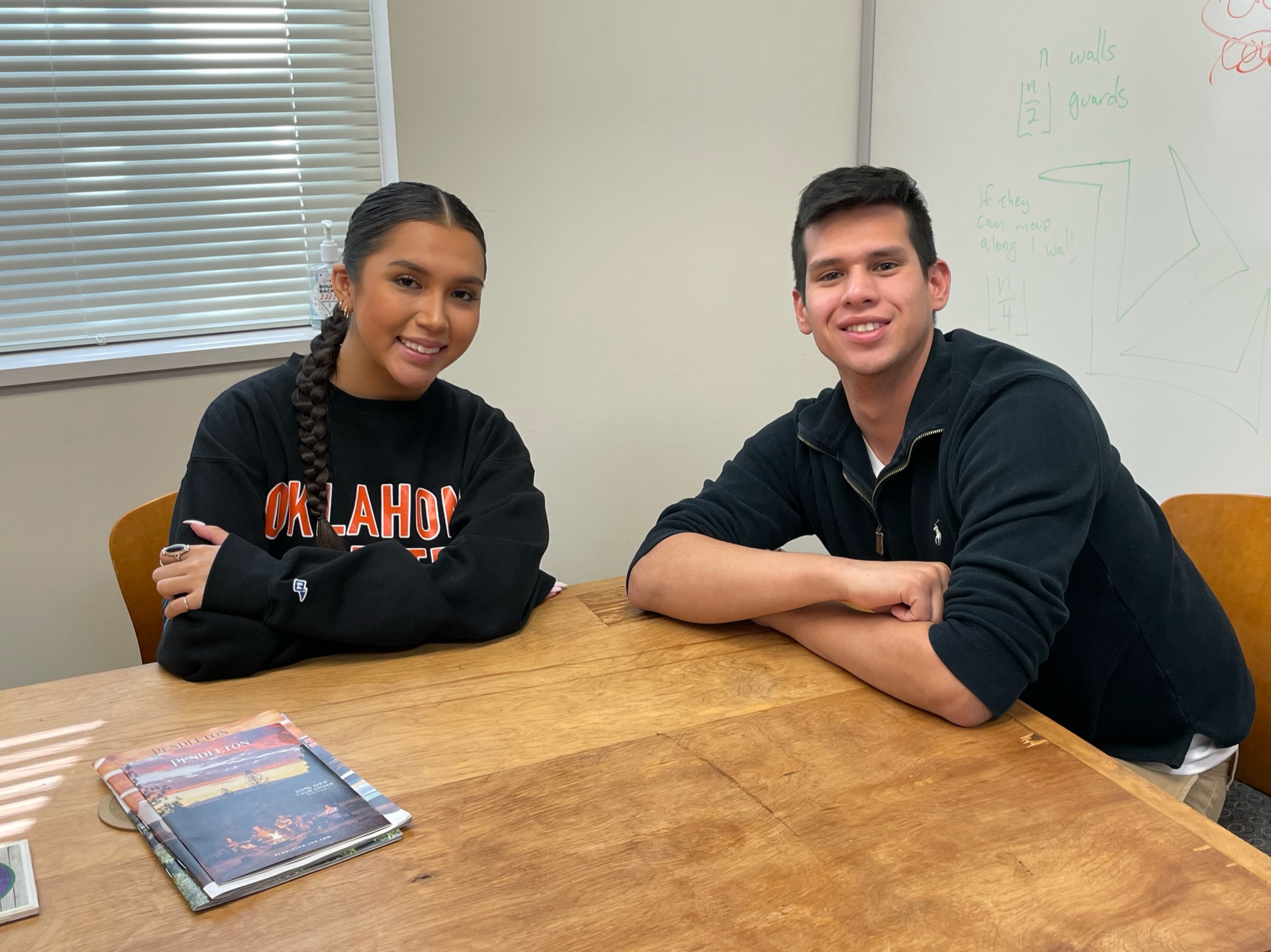 Miss American Indian OSU Gabby Pictured with Mr Luke sitting together at table
