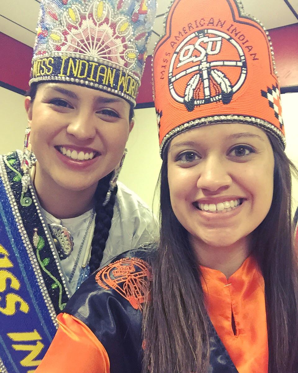 Miss American Indian OSU Pictured smiling in a selfie with Miss Indain World