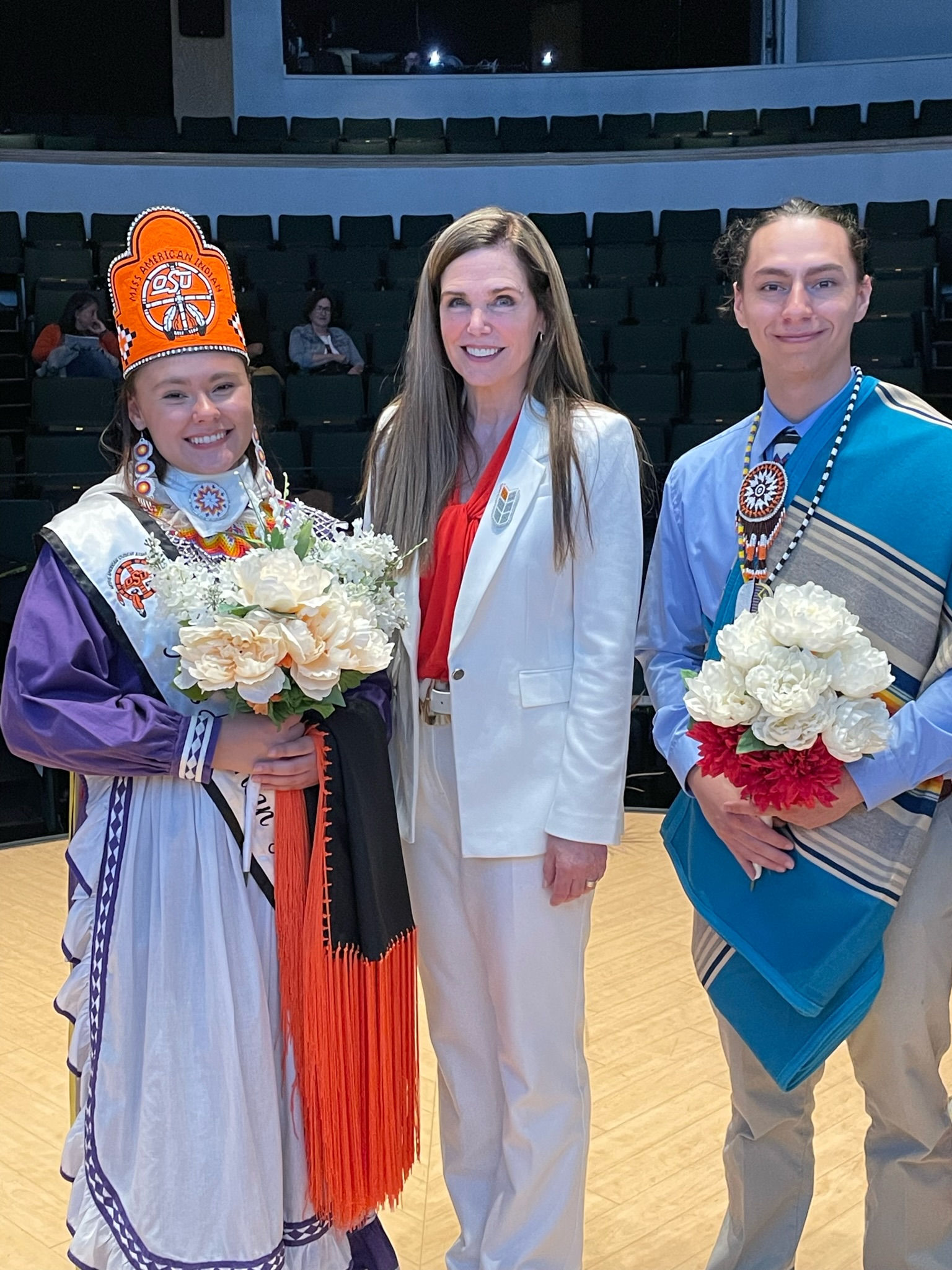 Miss American Indian OSU Shaeleigh and Mister American Indian OSU Caleb standing next to Elizabeth Payne, founding director of the Center for Sovereign Nations.