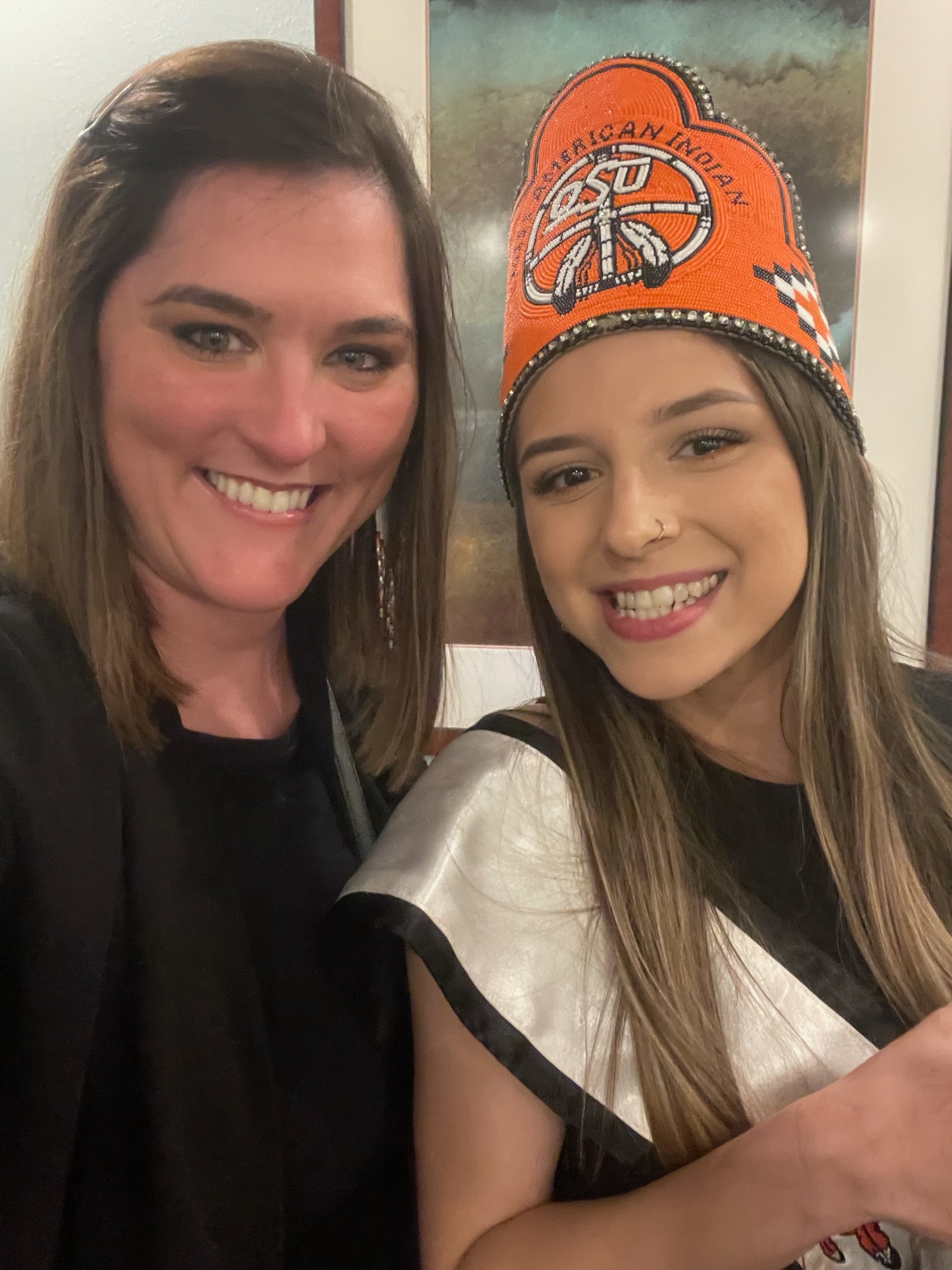 Miss American Indian OSU Lauren, wearing the MAIOSU crown, pictured smiling with Sky Rogers, interim director of the Center for Sovereign Nations.