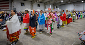 Grand entry during 2024 Powwow women wearing shawls