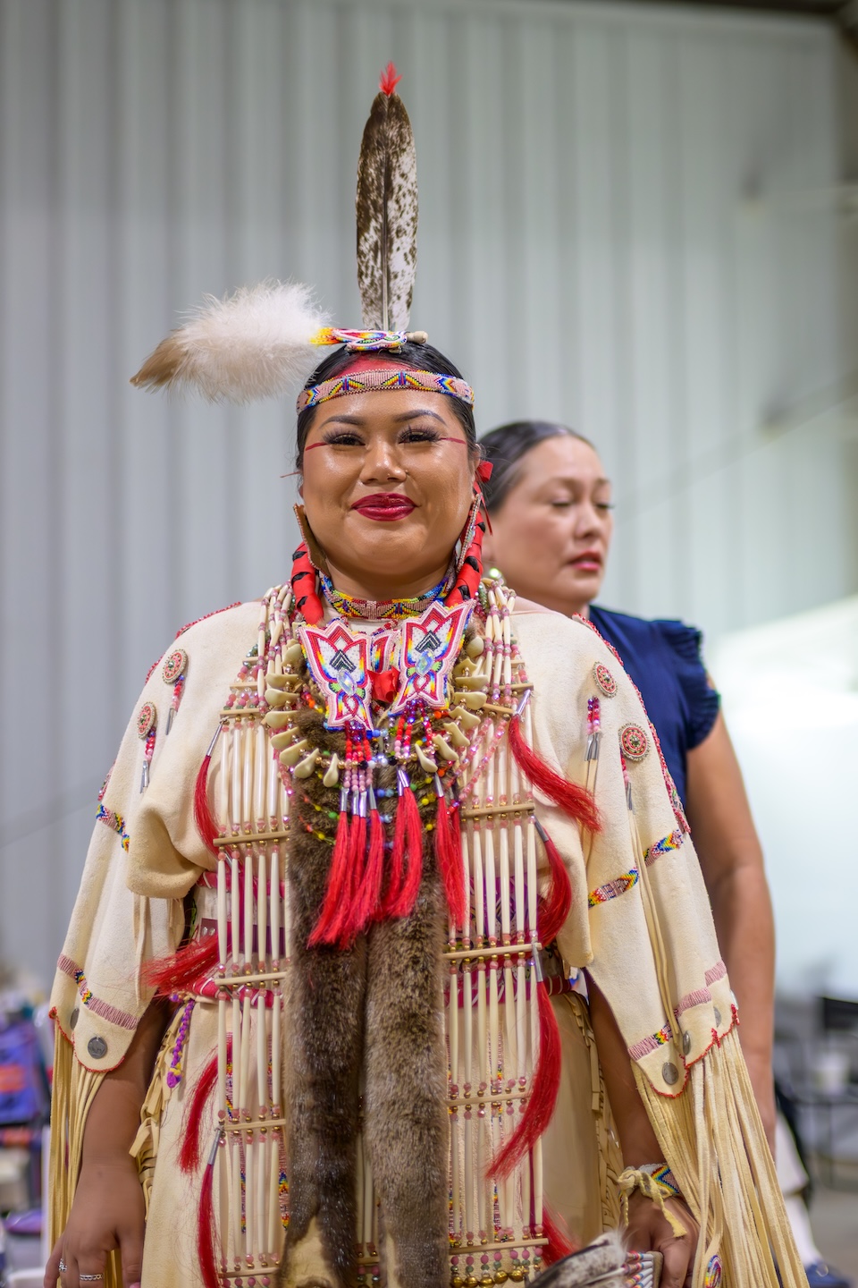 Headshot of Head Lady Jasmine OSU 2024 wearing buckskin regilia