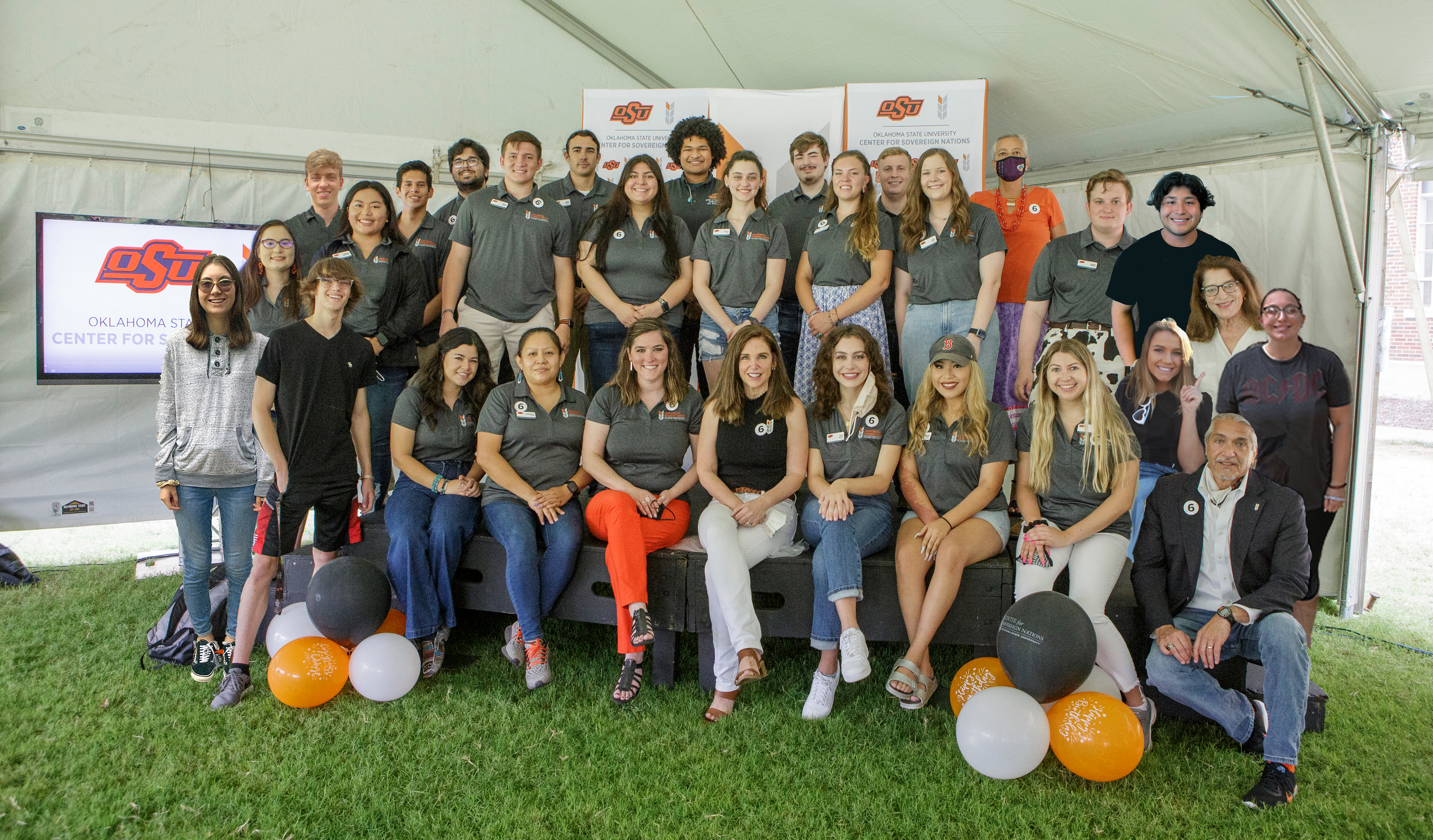 Group of Students with OSU Staff (Outside Under a White Tent)