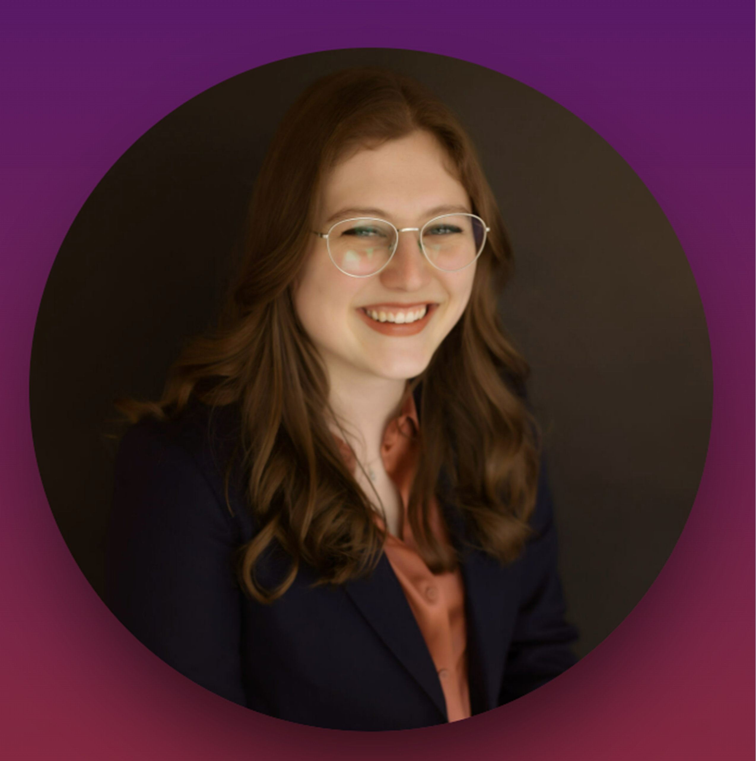 Headshot of Kelli Case in a black suit in front of a purple and brown background.